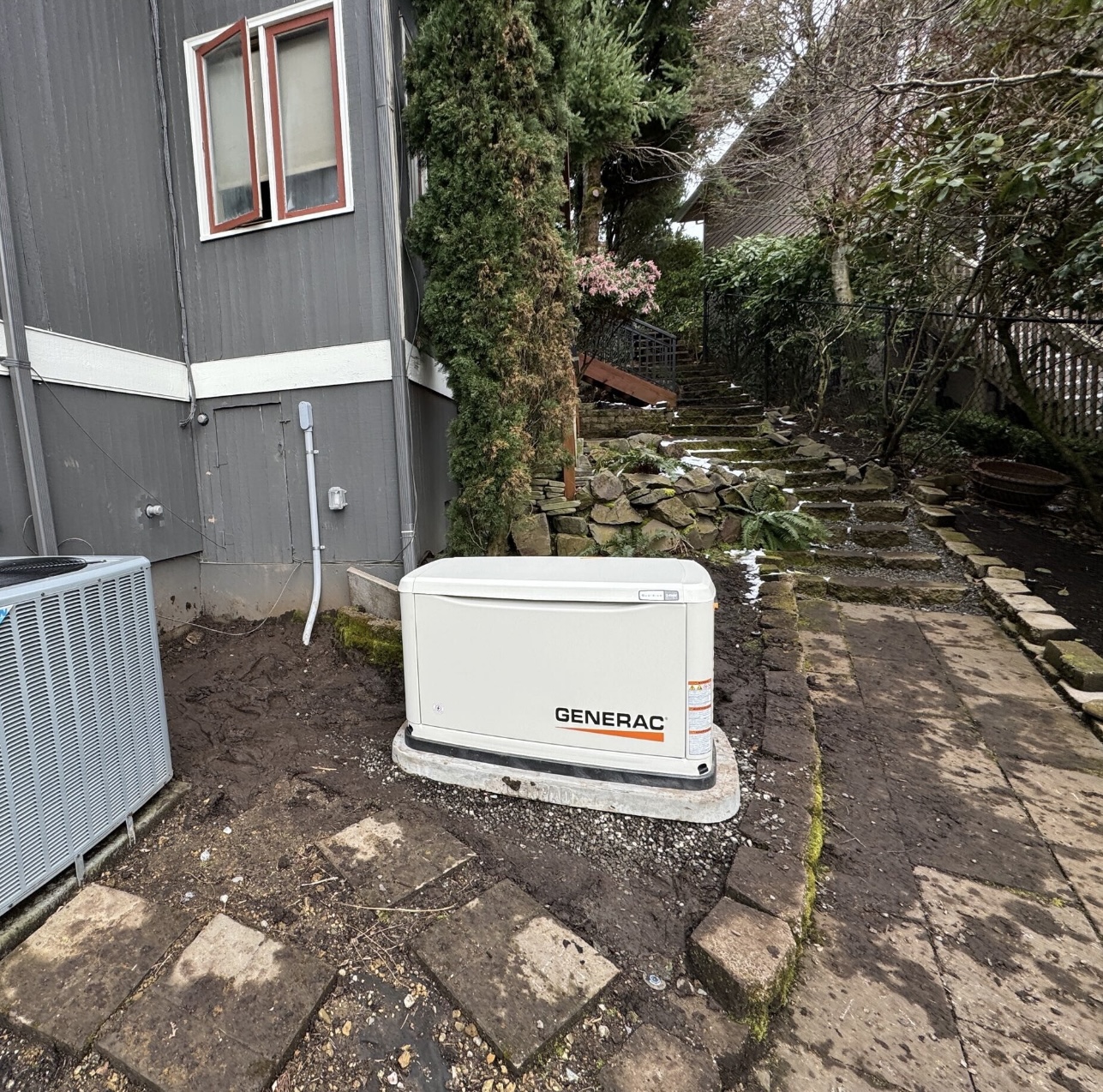 Standby generator installed beside a residential property.