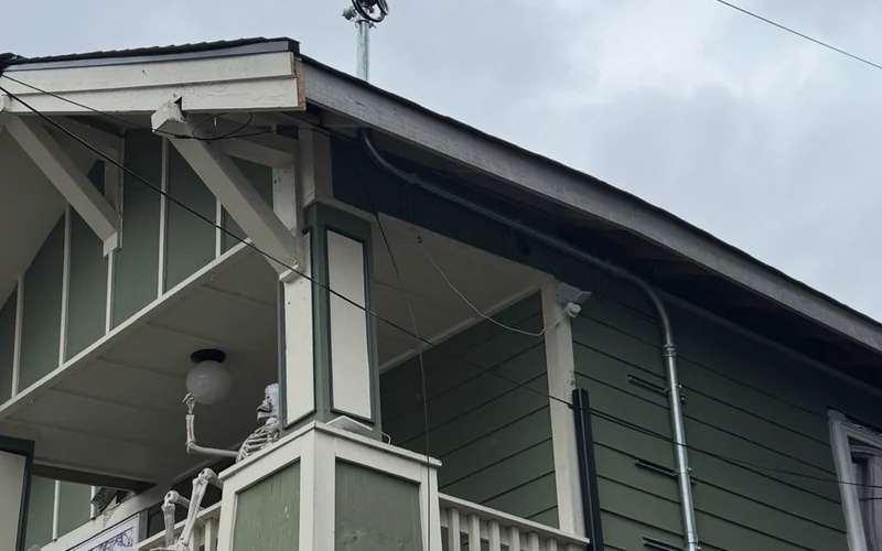 House exterior and overhead electrical service connection