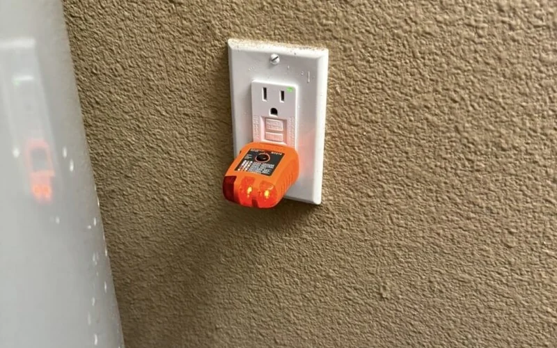 Outlet tester plugged into a residential receptacle